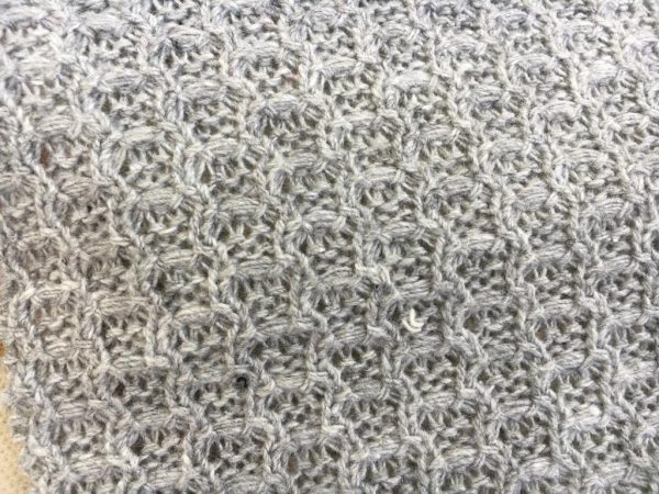 Uniqeu shape grey knitted fabric in Kamer Fabric