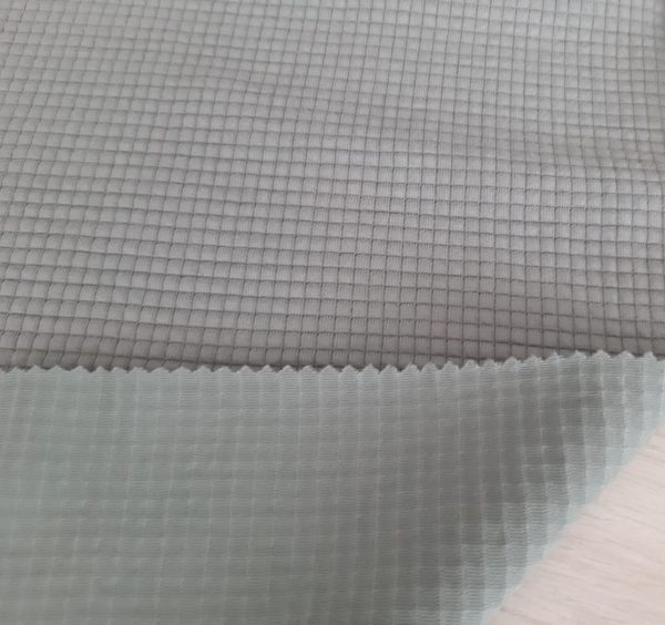 White jacquard interlock fabric in Kamer Fabric