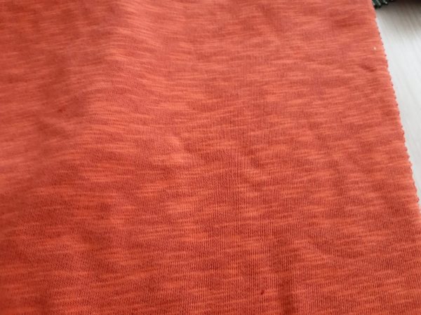 Melange orange knitting fabric in Kamer Fabric